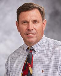 Dr. John        Martin