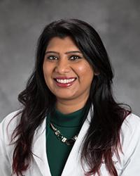 Dr. Navpreet                                           Sidhu