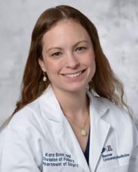 Dr. Kara                Brock