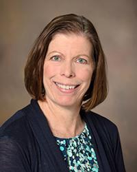 Dr. Catherine                      Riley